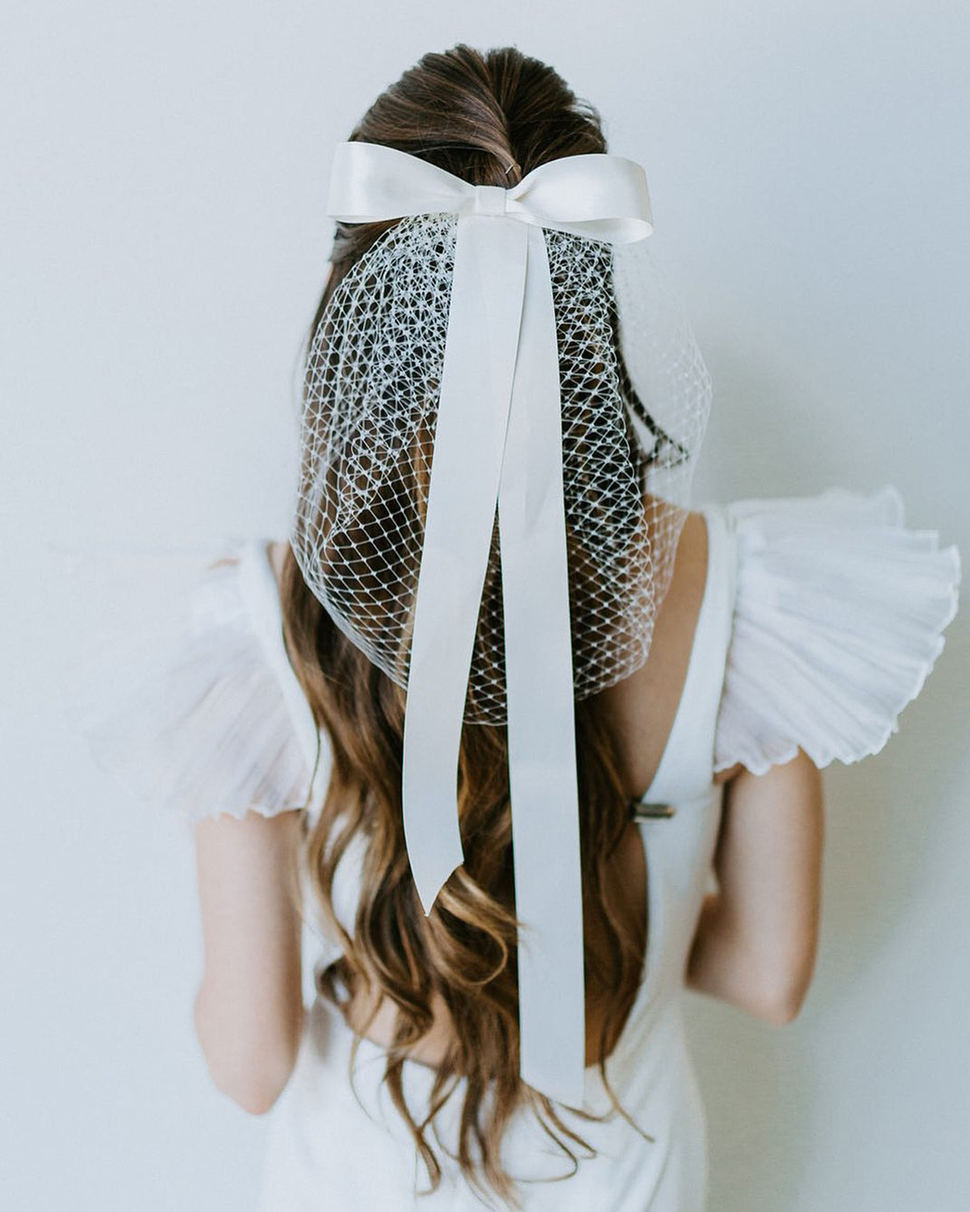 wedding hair accessories half up textured with white bow untamedpetals