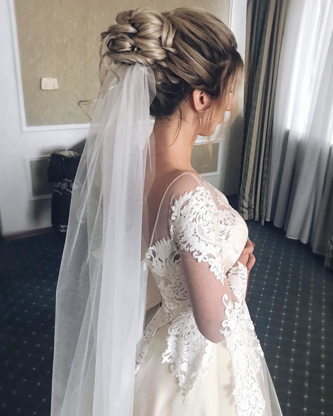 wedding hairstyles with veil high bun textured with curls belaya_lyudmila
