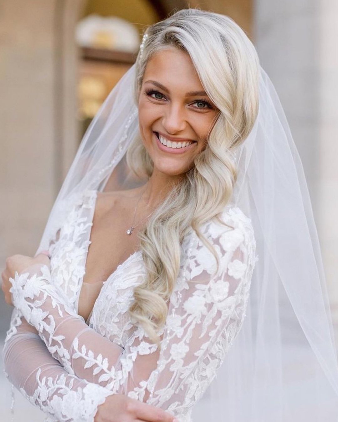 wedding hairstyles with veil side swept blonde hair down haircomesthebride