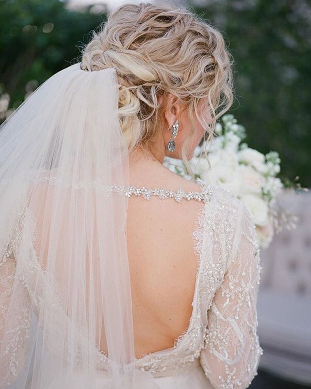 wedding hairstyles with veil slightly messy curly updo haircomesthebride