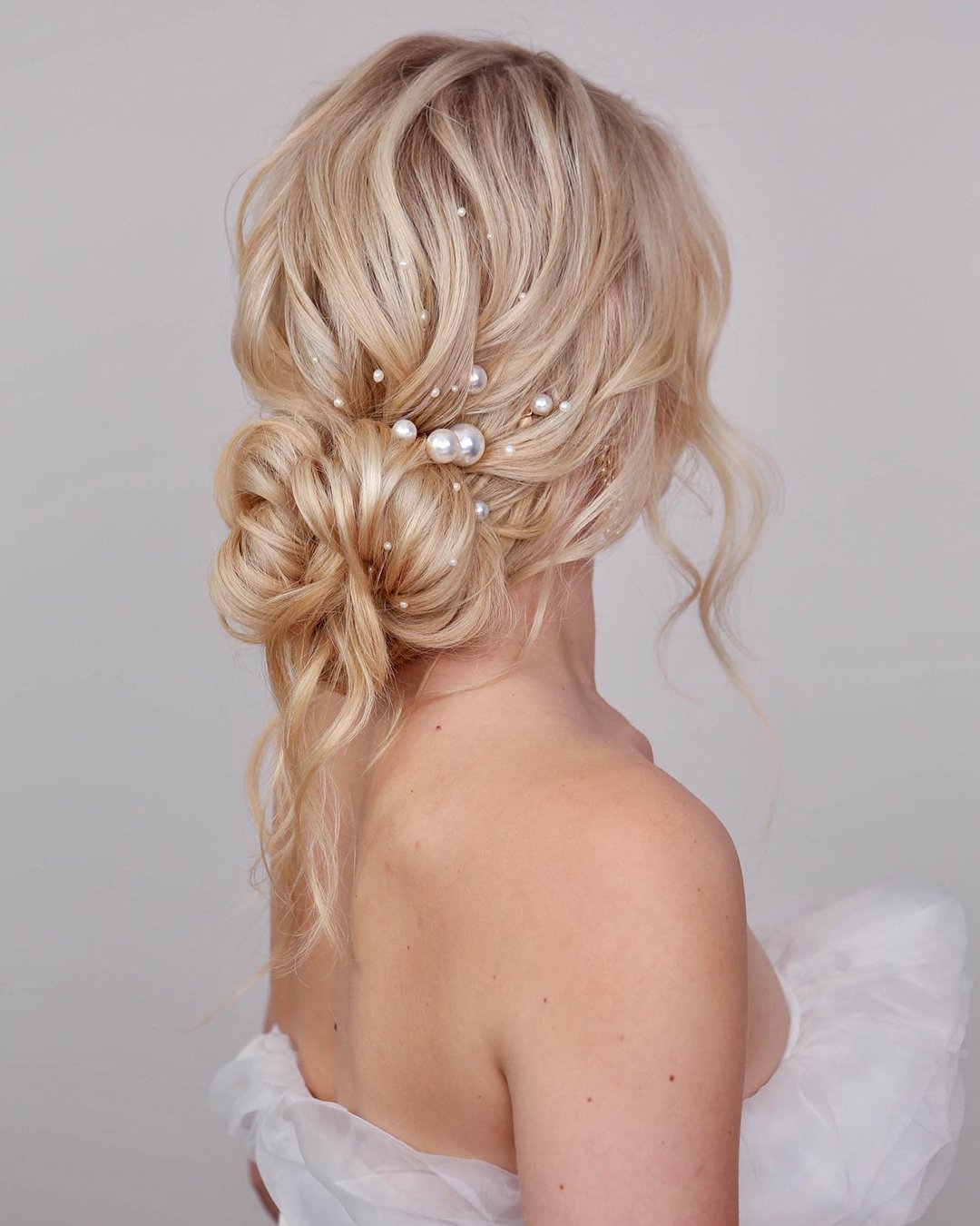 wedding updos for long hair slightly messy textured with pearls kristinagasperasmua