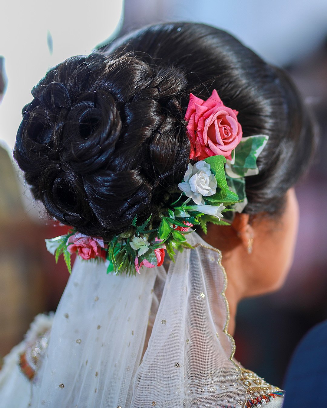 black women wedding hairstyles bun with flowers and veil shutterstock