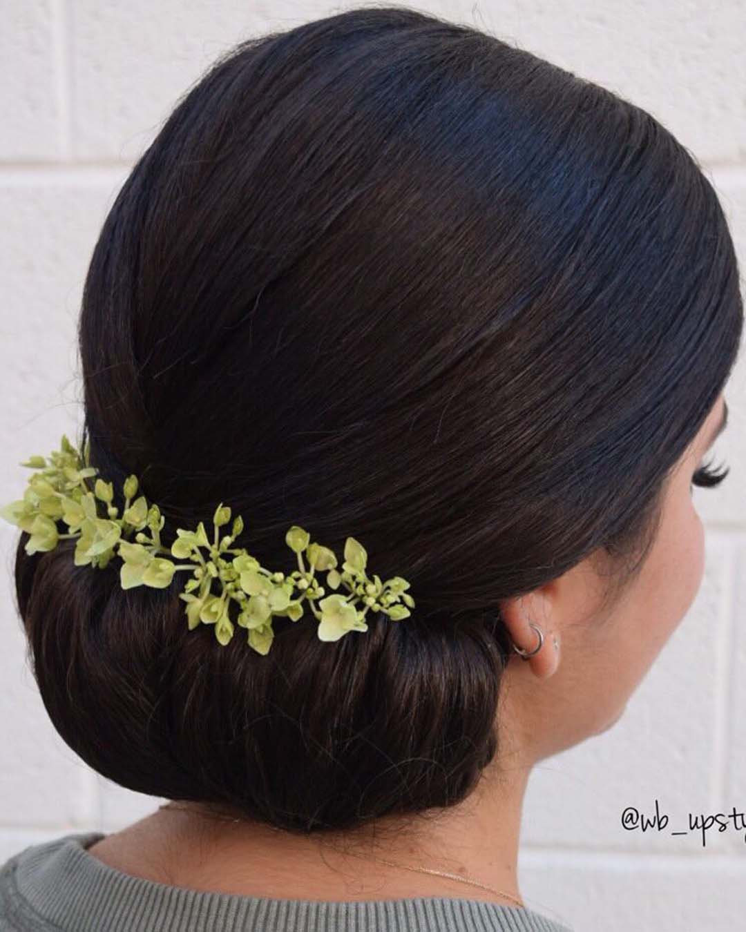 black women wedding hairstyles chignon with flowers wb_upstyles
