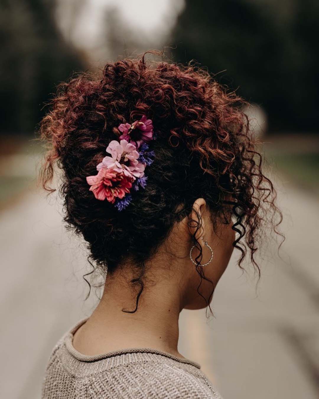 black women wedding hairstyles curly updo with flowers updos.by.jocelyn