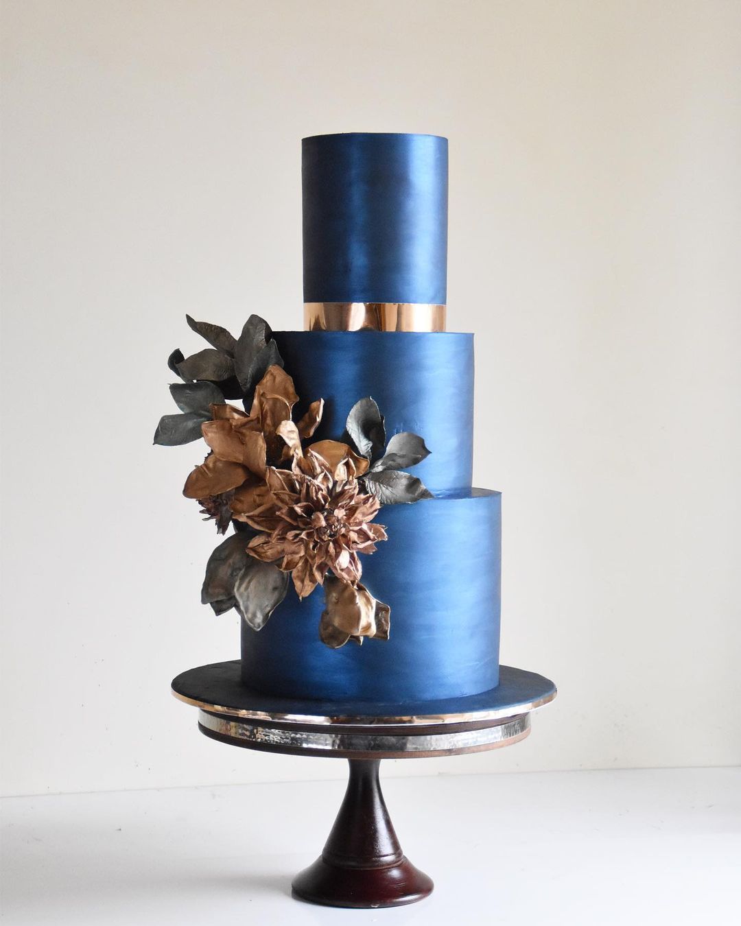 colored wedding cakes with metalic fragments blue