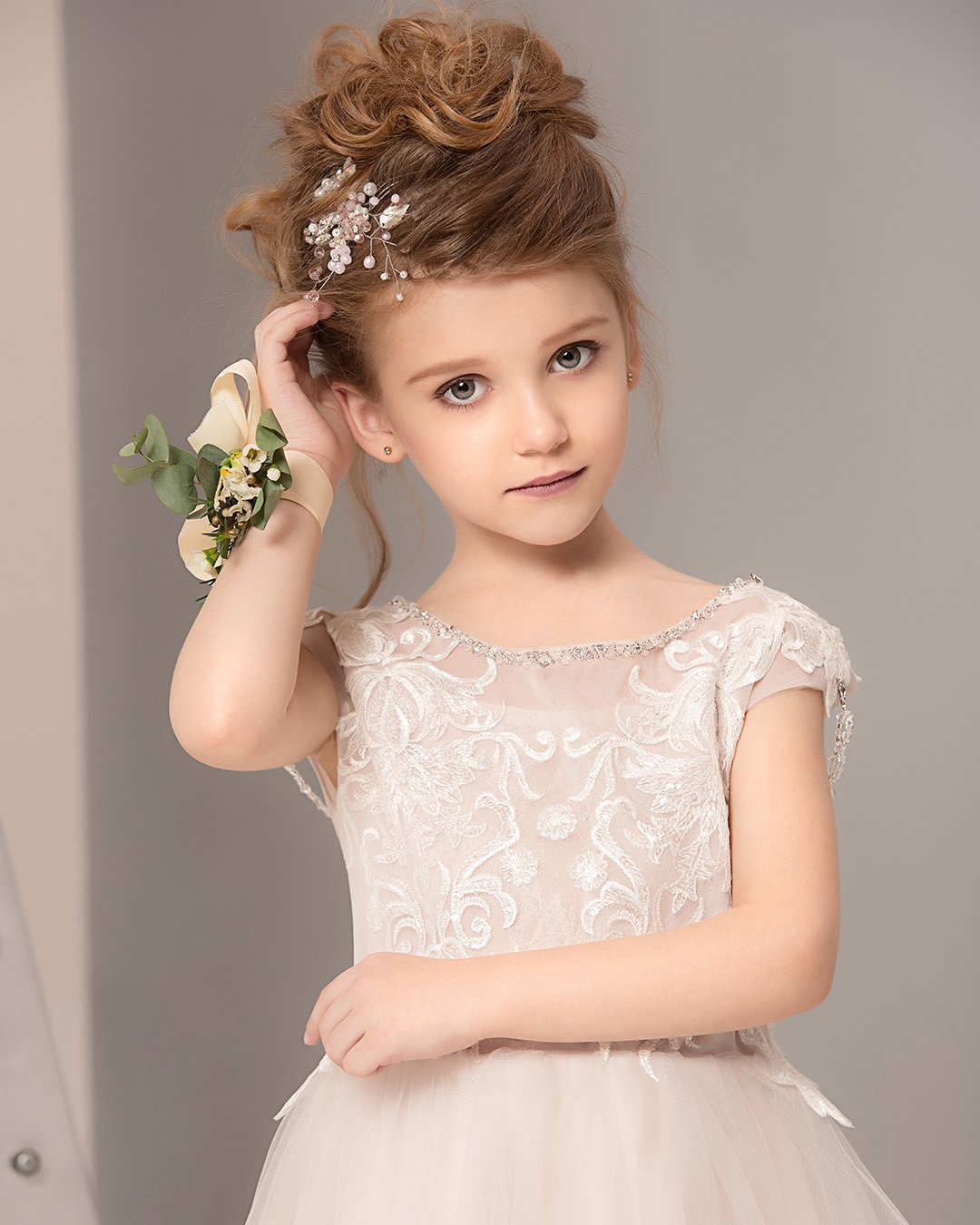 flower girl hairstyles messy high updo with vine shutterstock