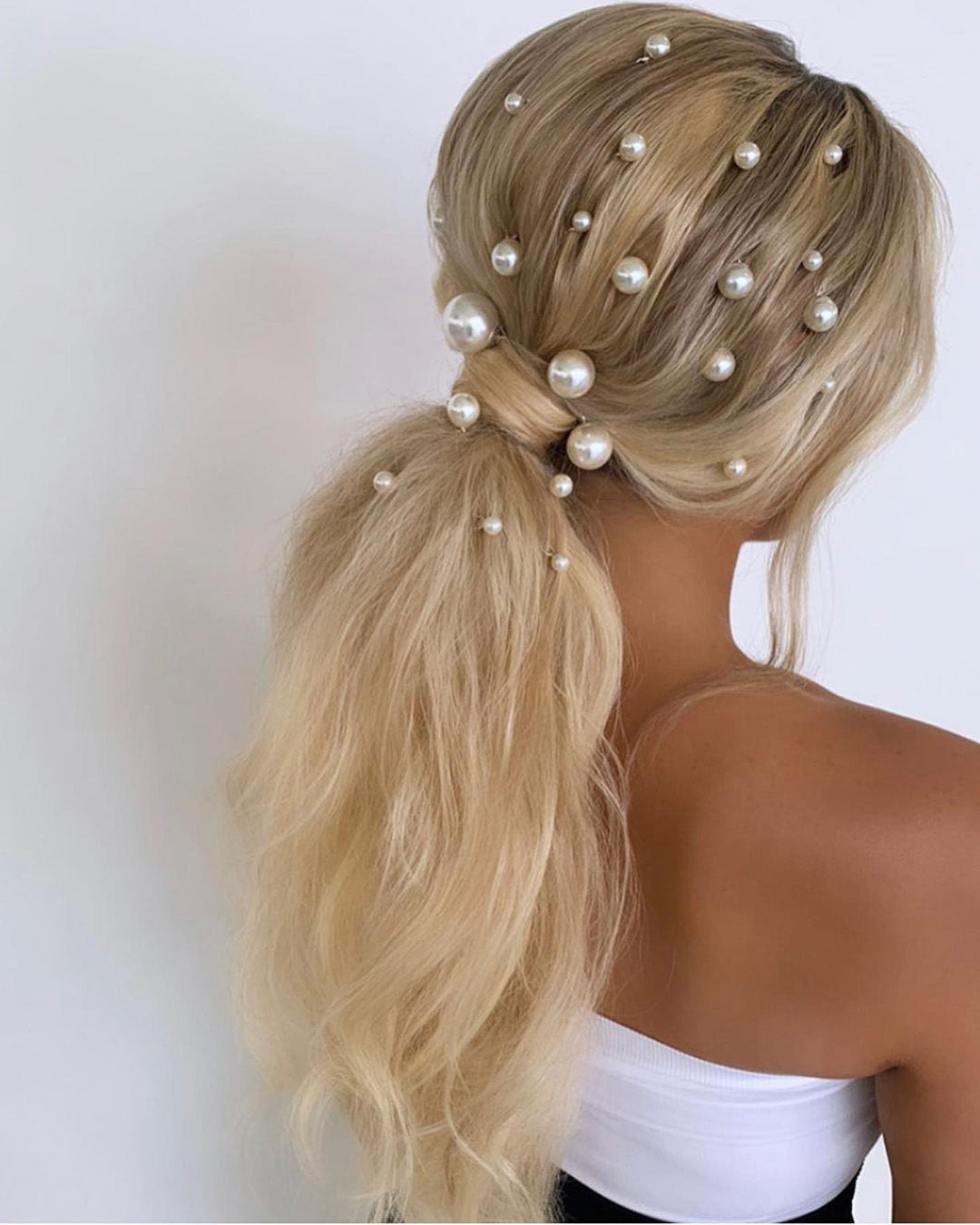 beach wedding hairstyles simple ponytail with pearls thebeautysuiteny