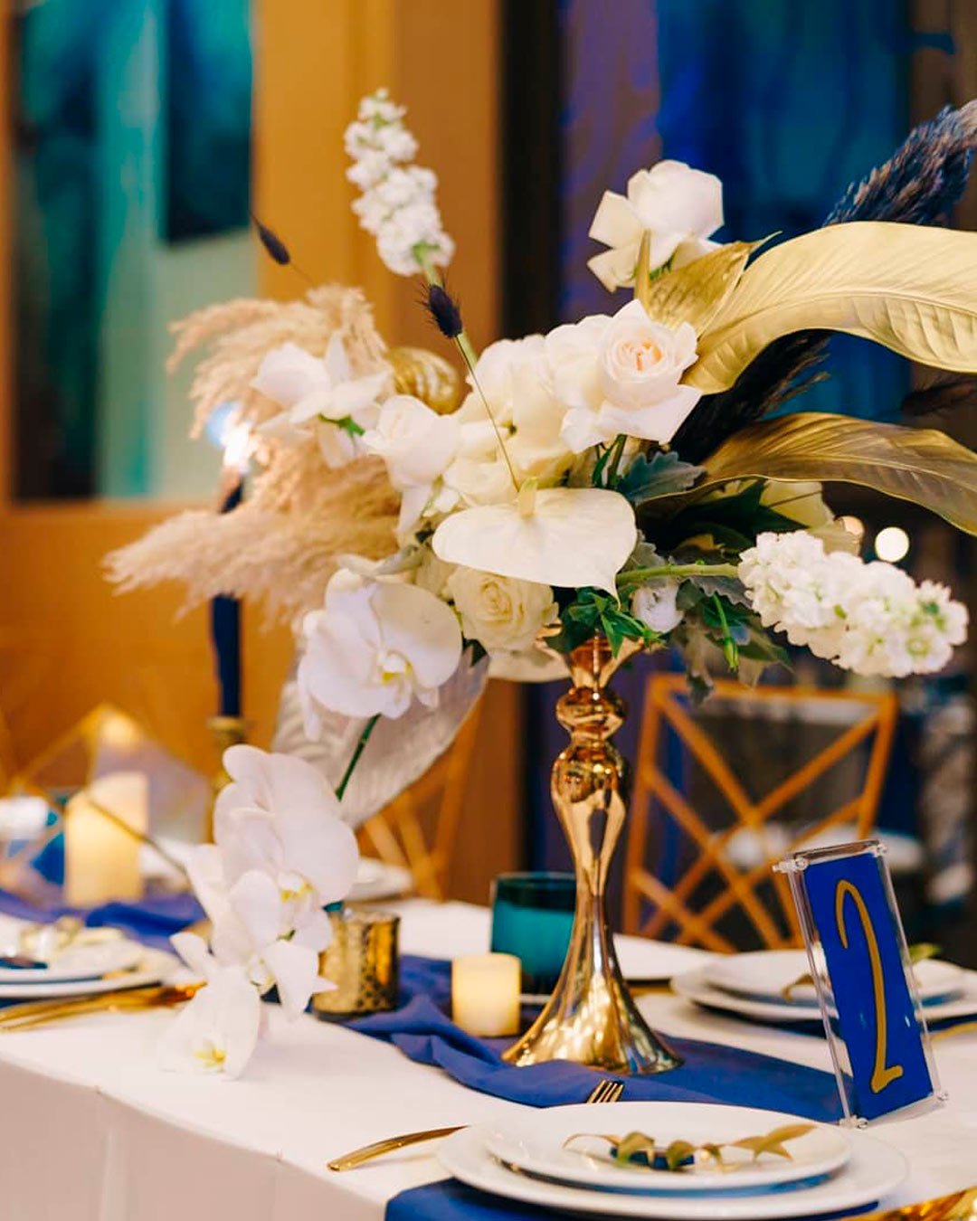blue and gold wedding theme flowers arrangement
