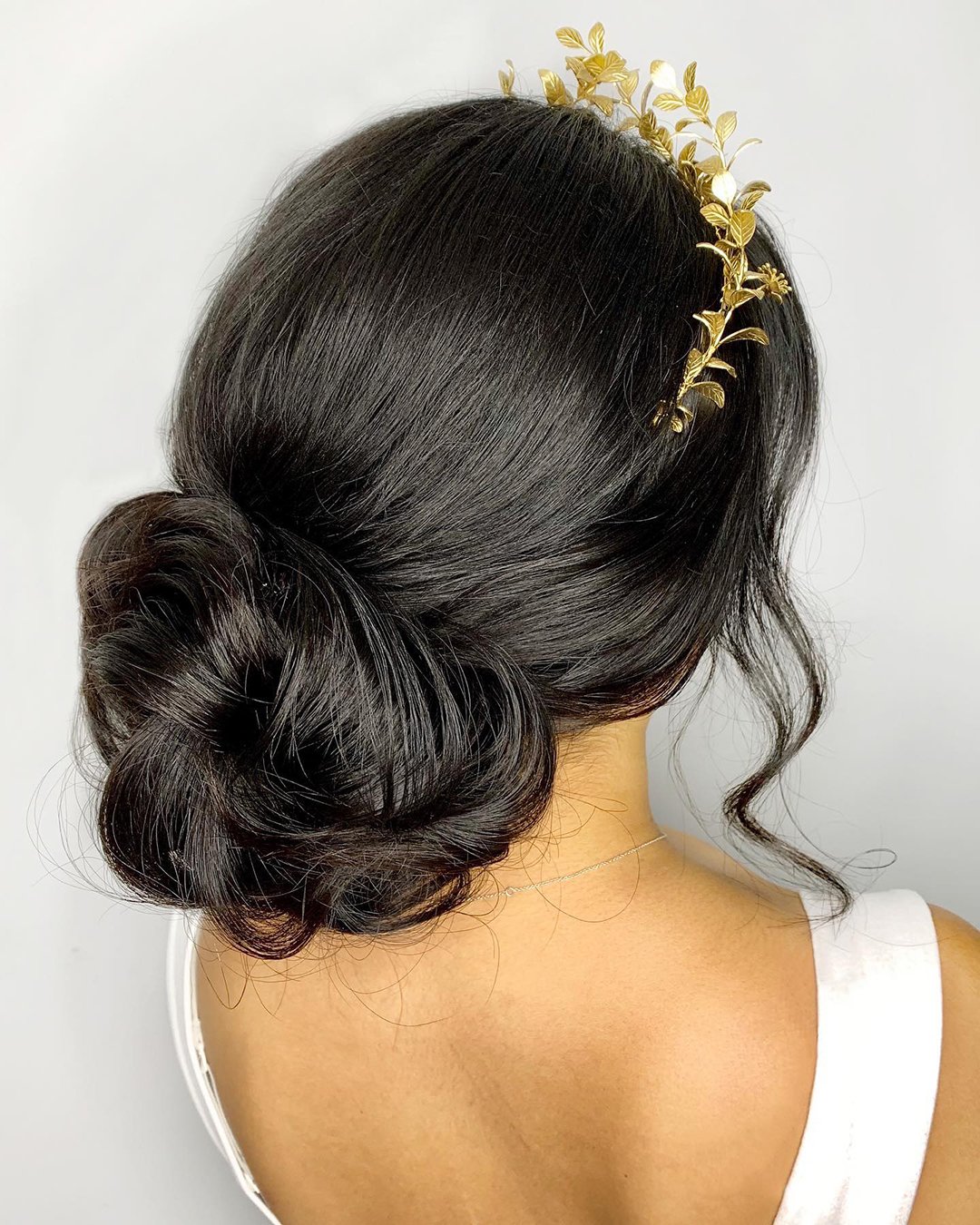 fall wedding hairstyles bun with gold flowers bridalhaircouturebykatie