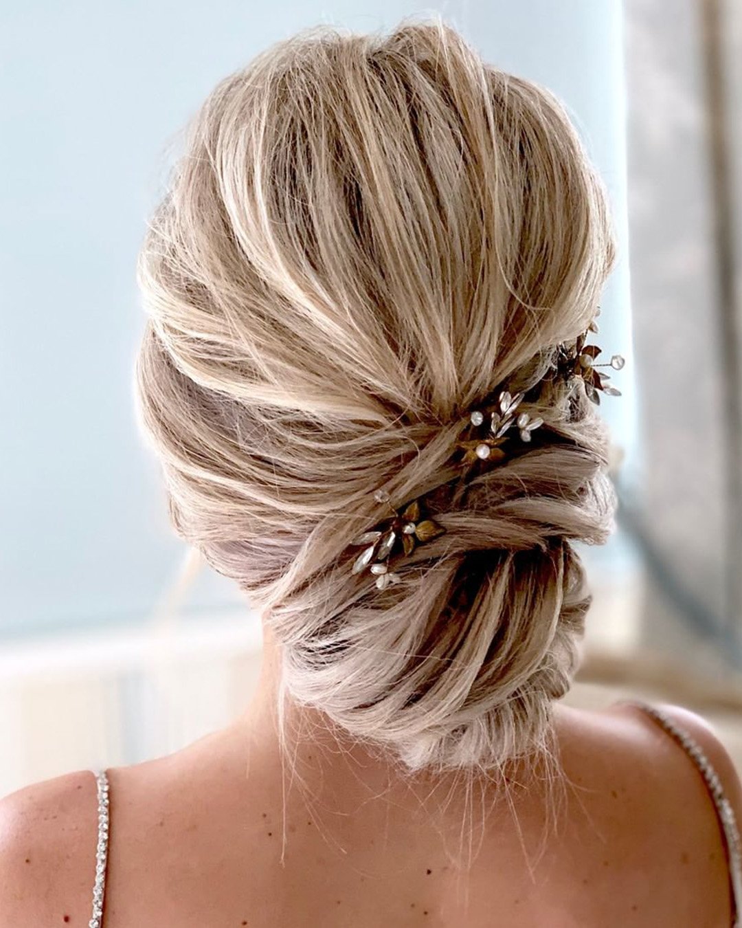 low bun hairstyles for wedding elegant textured messy clairehartleystylist