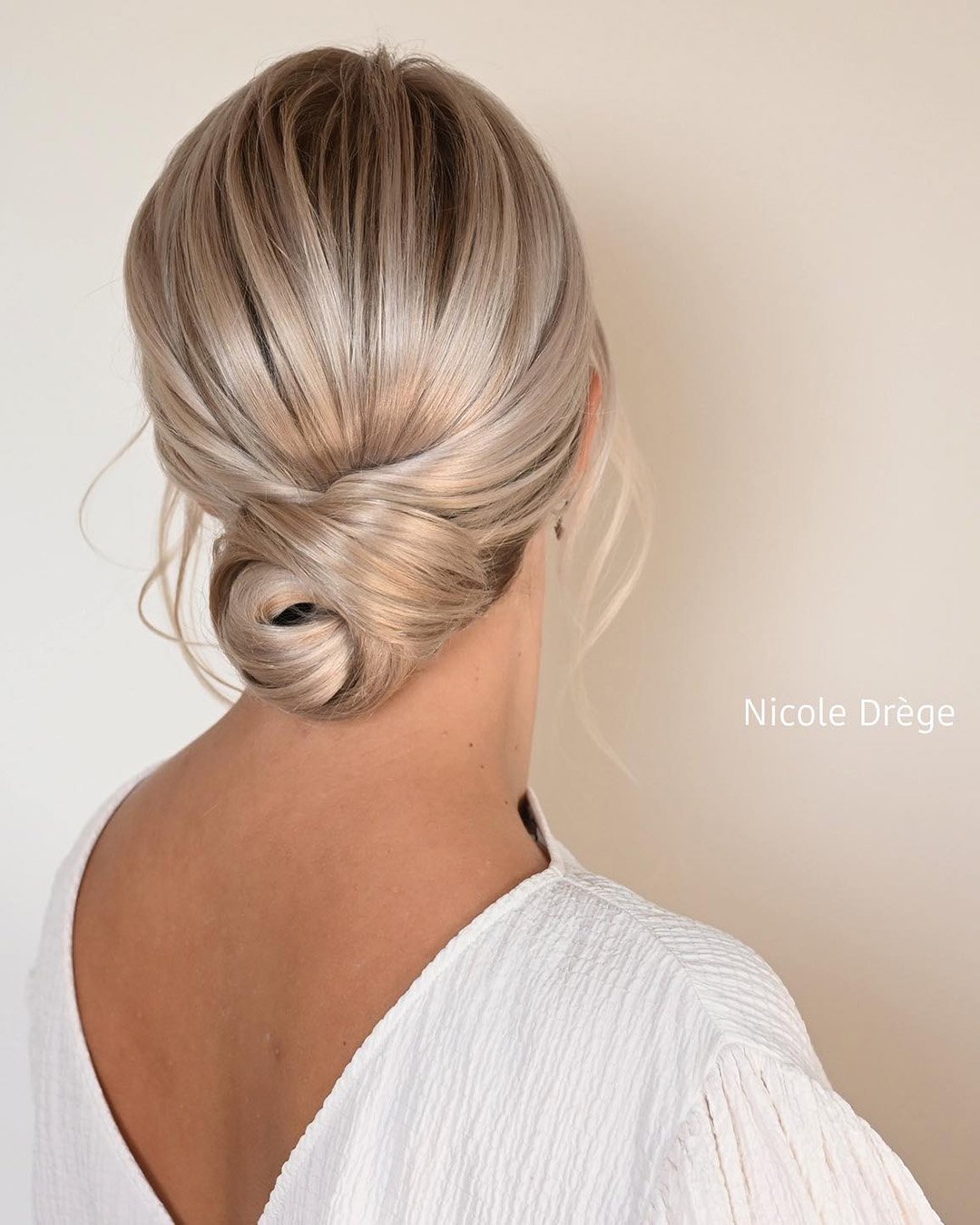 low bun hairstyles for wedding smooth side swept nicoledrege