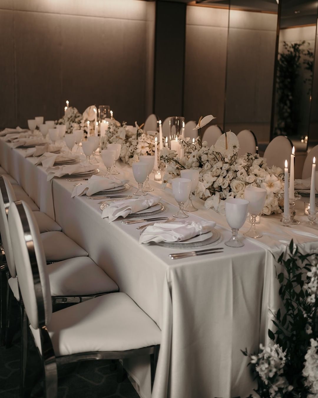 modern wedding decor florisitcs and candles in white