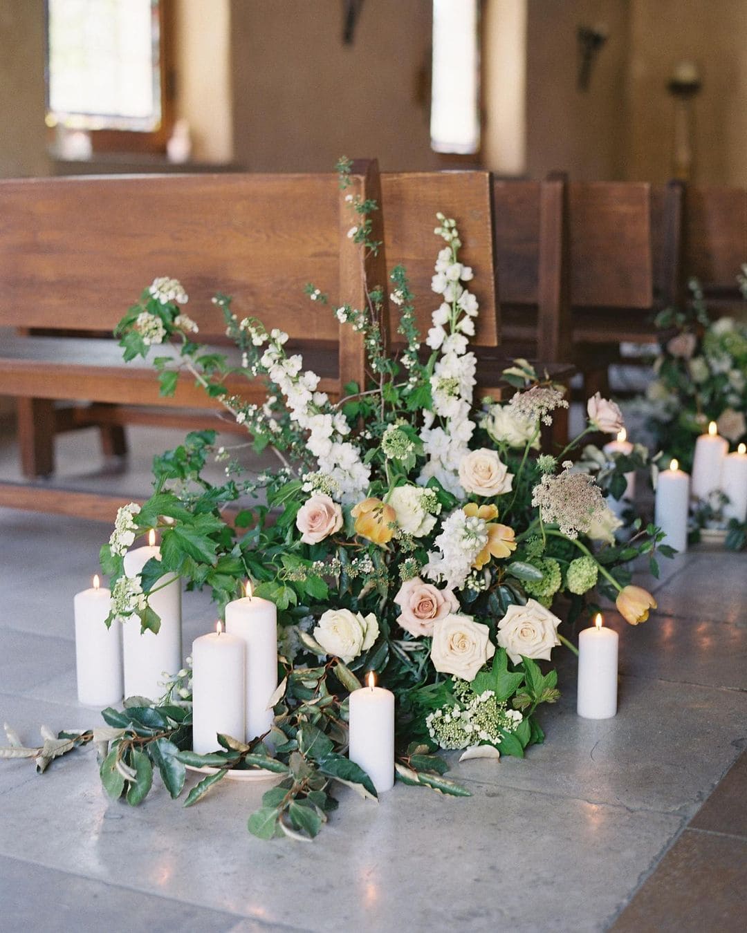 modern wedding decor flowers and candles for church