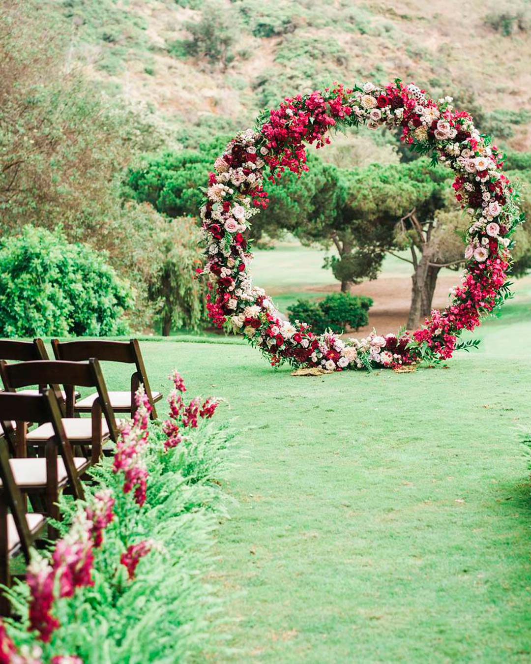 red and black wedding theme aisle arch