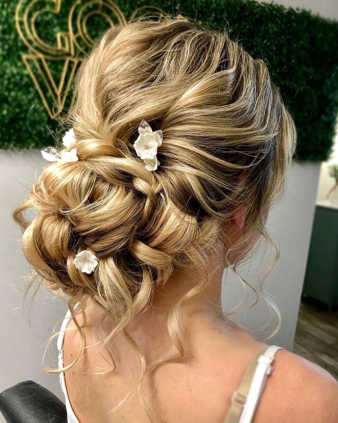 spring wedding hairstyles low bun with loose curls alexandralee1016