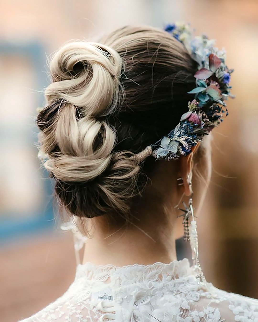 spring wedding hairstyles simple updo with flower halo clairehartleystylist
