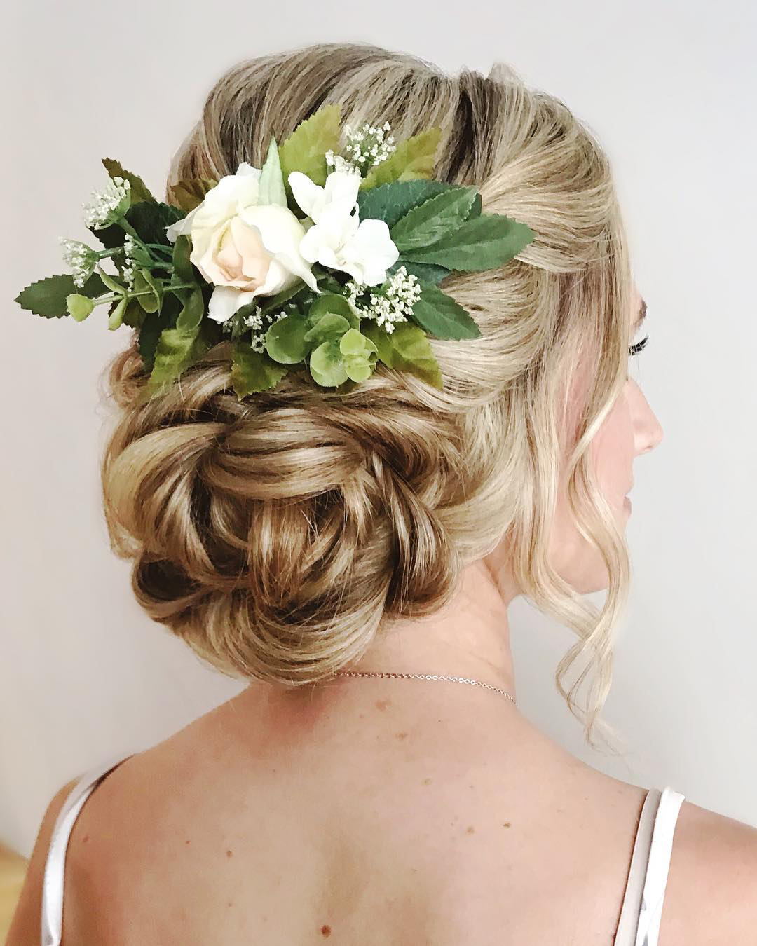 summer wedding hairstyles bun bun with flowers rosy_nyk_muah