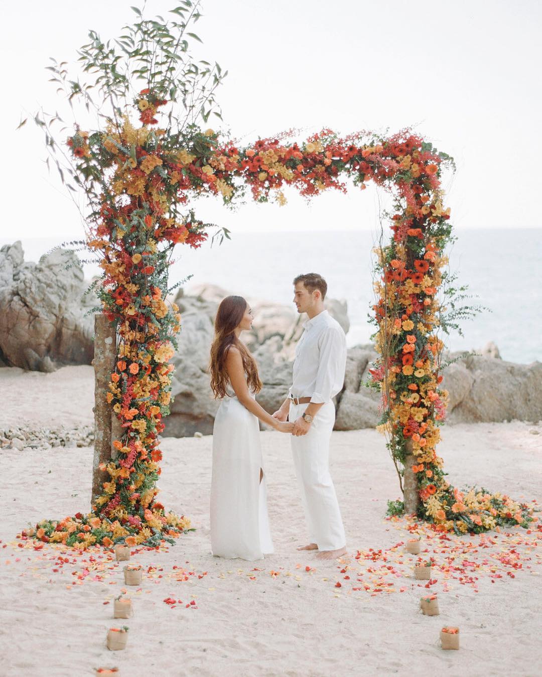 terracotta-wedding-colors wedding arch on beach