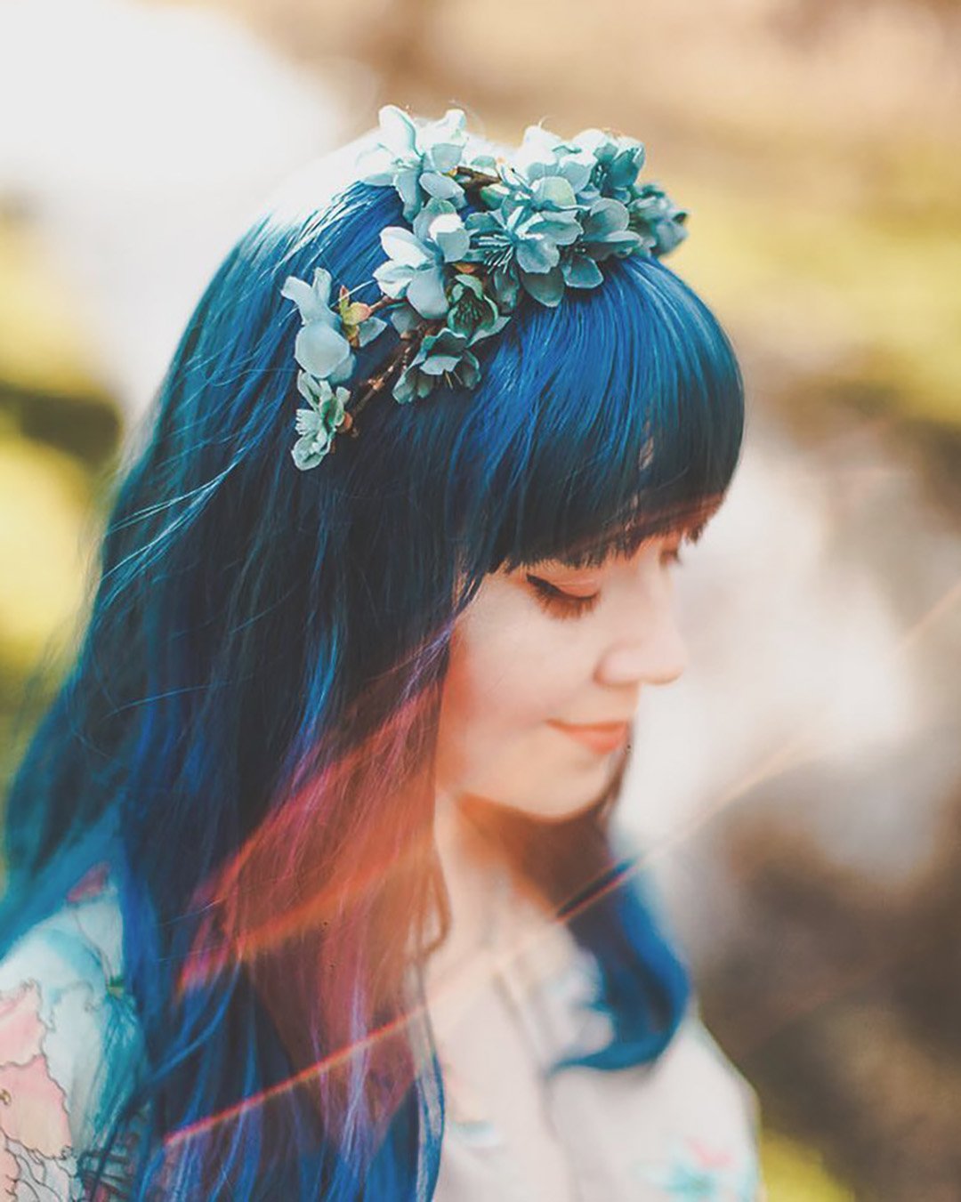 wedding hairstyles with crown with blue flowers gardensofwhimsy
