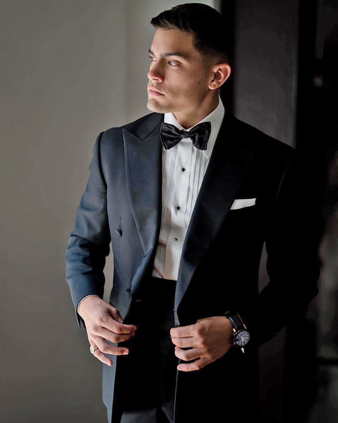 all black suit and bow tie