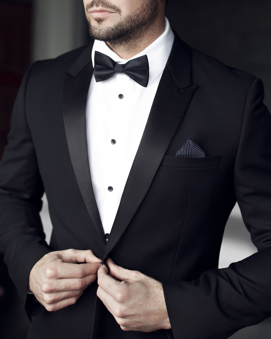 black wedding suit tuxedo with bow tie white t shirt shutterstock