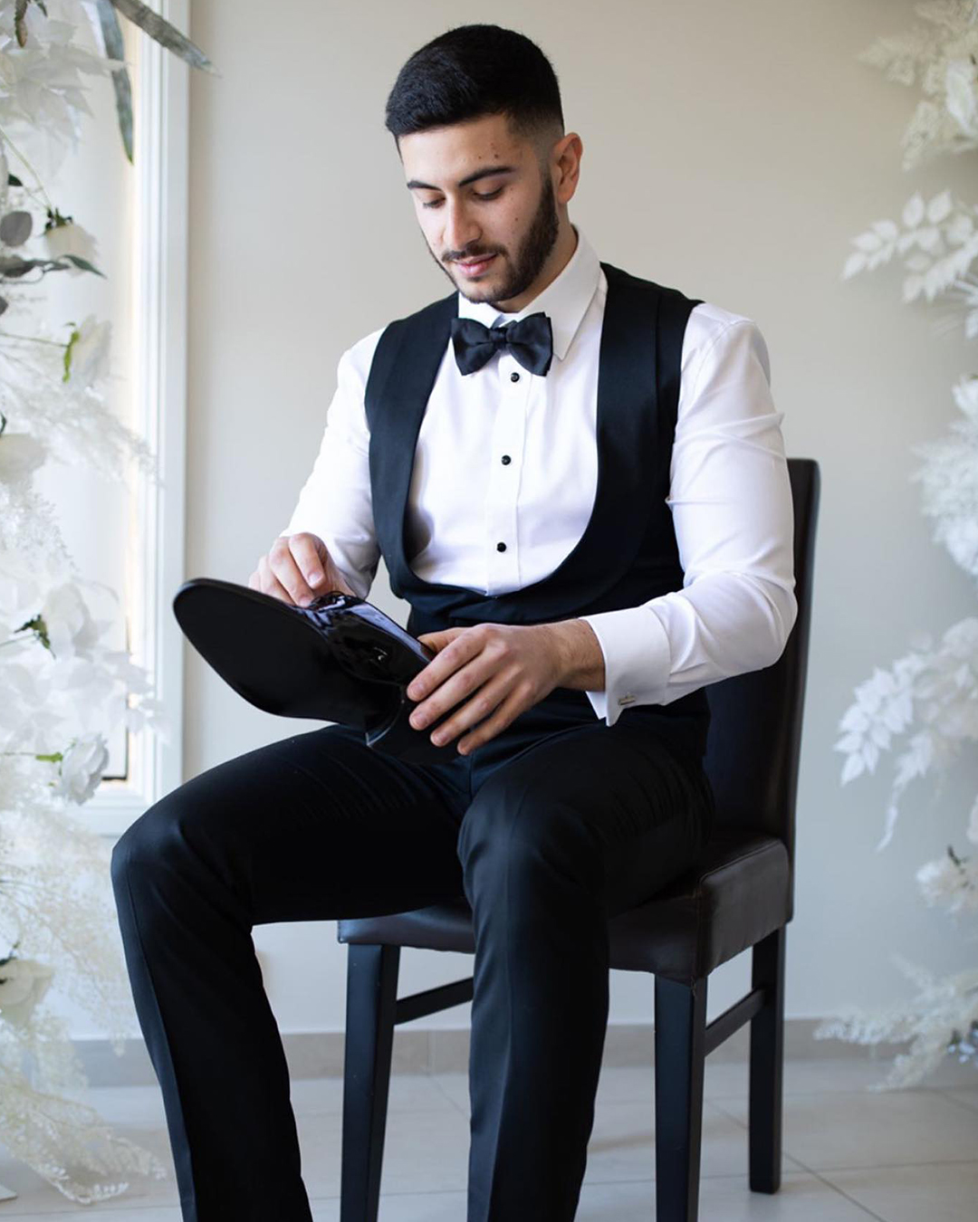 black wedding suit with bow tie white t shirt vest suavebespoke
