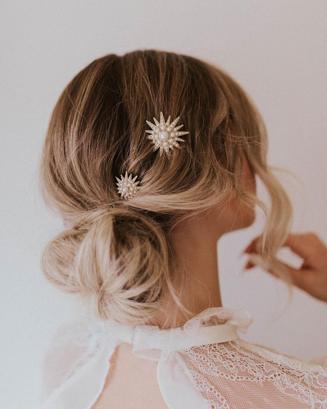 bridal hair pins low bun with white pearly flakes untamedpetals