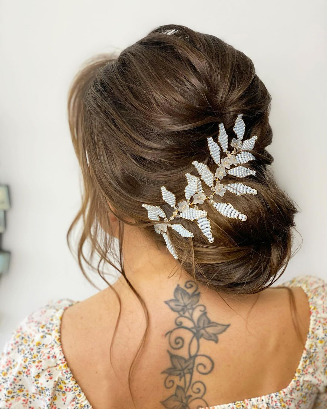 bridal hairpiece low bun with wine and beads monamieweddinghair