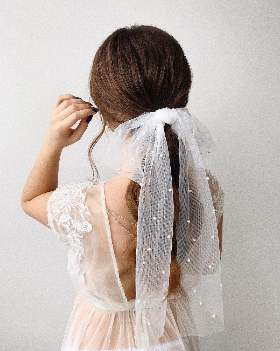 bridal hairpiece white ribbon on long ponytail samoylenko_makeup