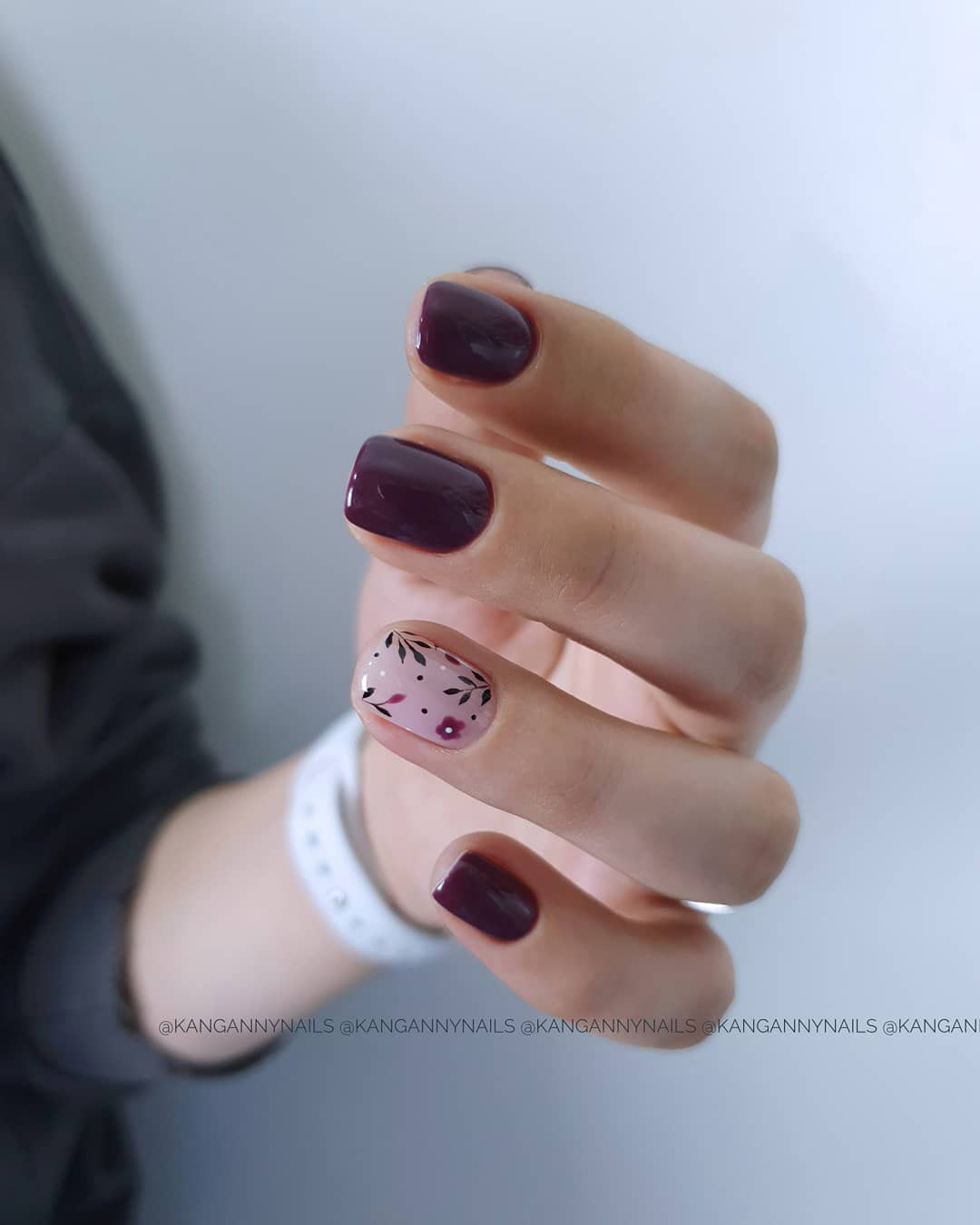 fall wedding nails dark burgundy with flowers on one finger kangannynails