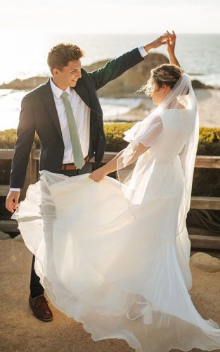how to make a wedding playlist newlyweds dancing together featured