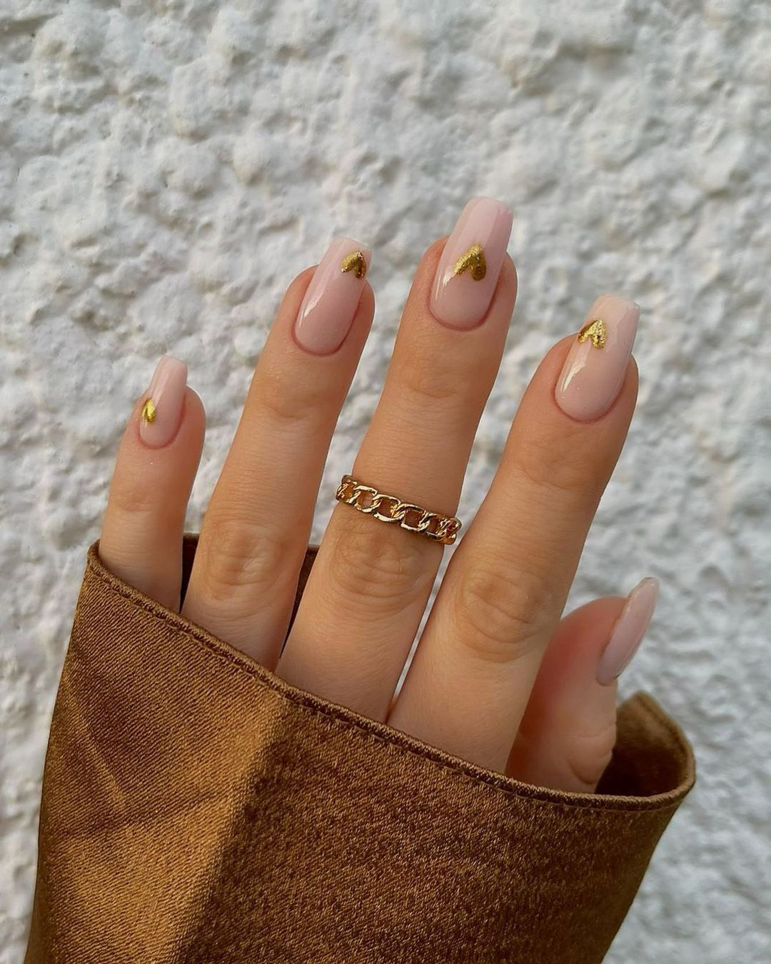 simple wedding nails nude with gold hearts charsgelnails_