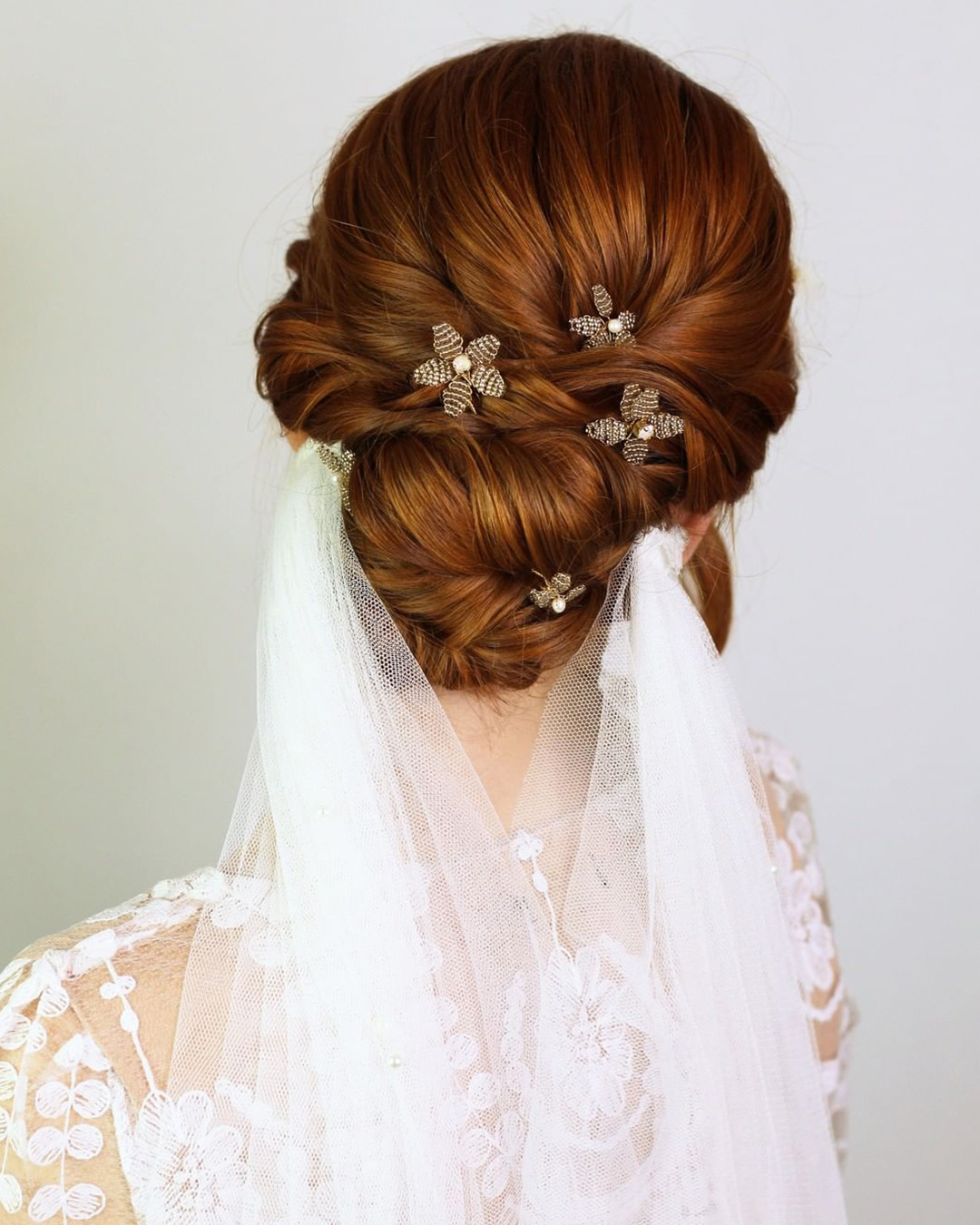 wedding hairstyles for long hair low bun with veil stormemakeupartist