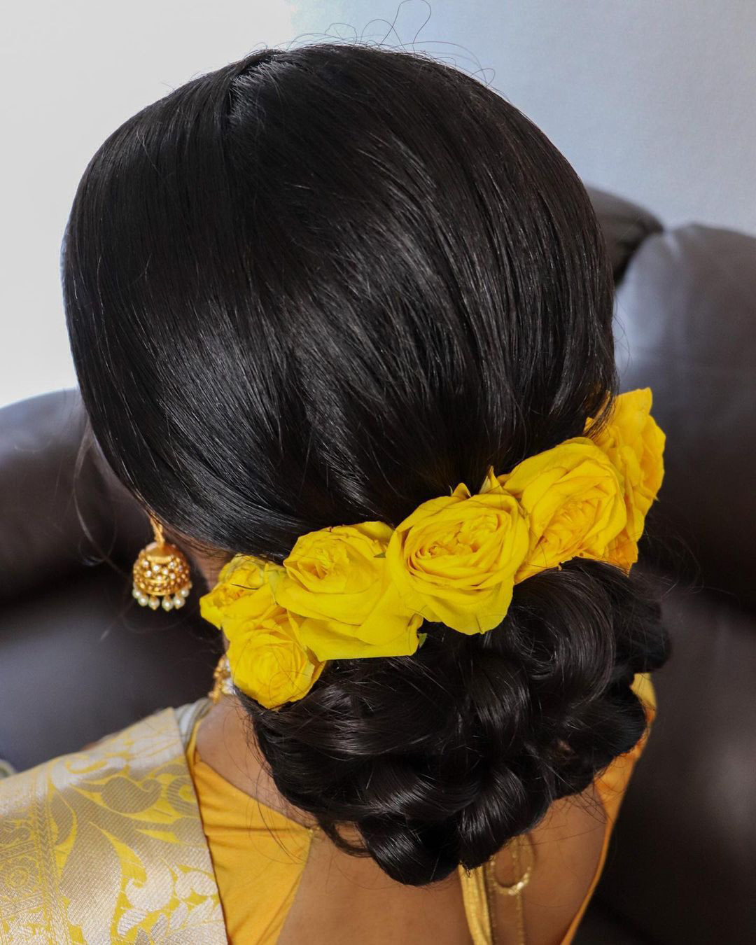 wedding hairstyles with flowers yellow roses in low chignon theparismakeup