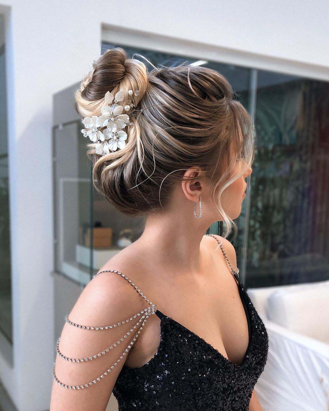 bridesmaid hairstyles classy high bun with flower pins mateusgibertone
