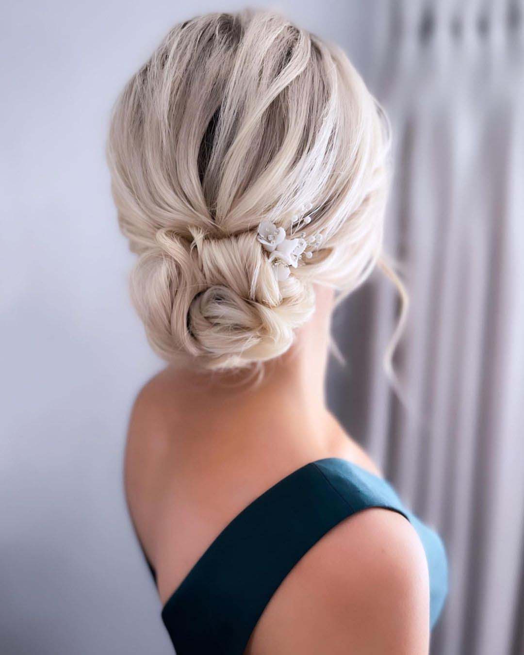 bridesmaid hairstyles romantic low bun blonde hannahblinkohairstylist