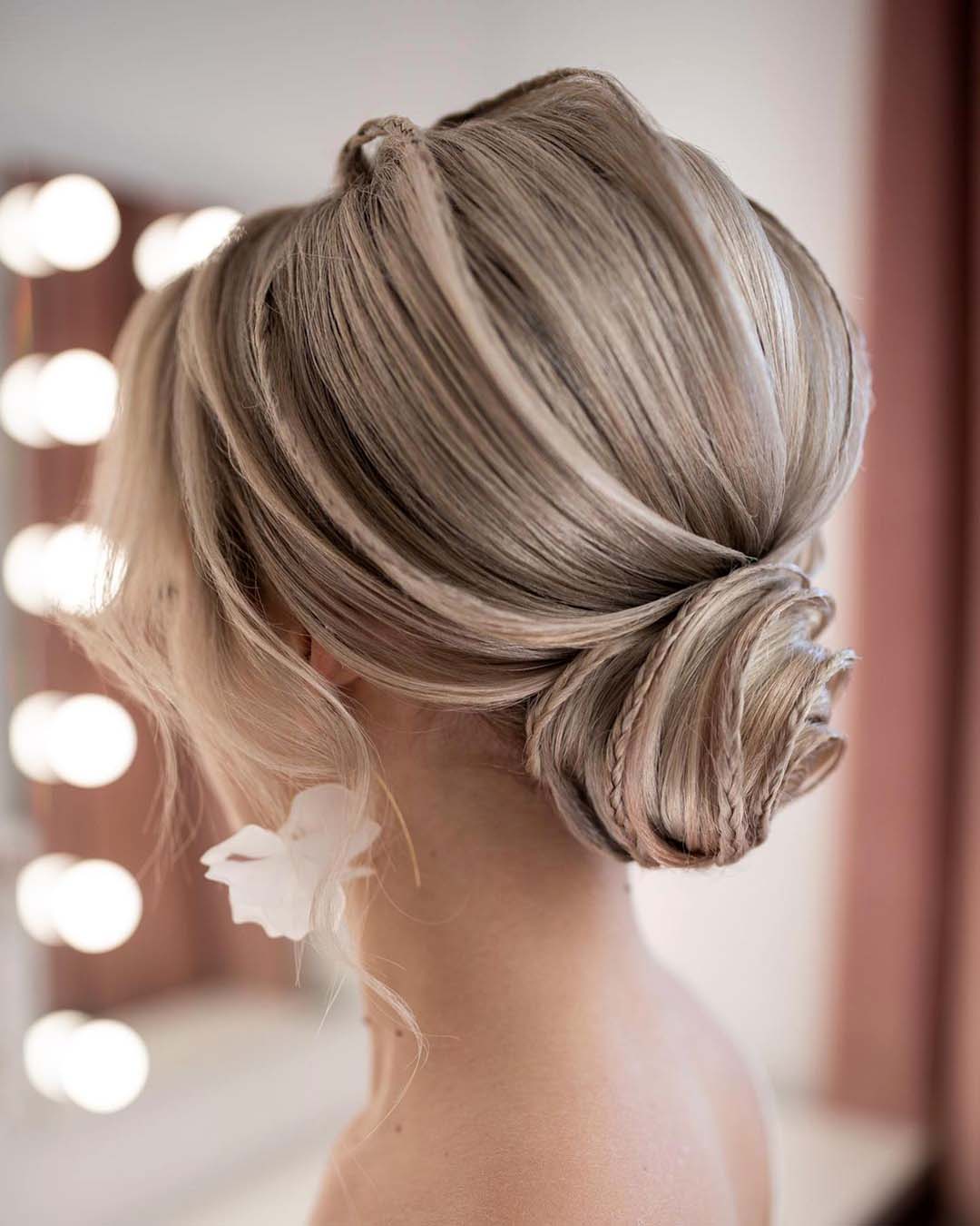bridesmaid hairstyles textured low bun with small braid beautybyrockagirl
