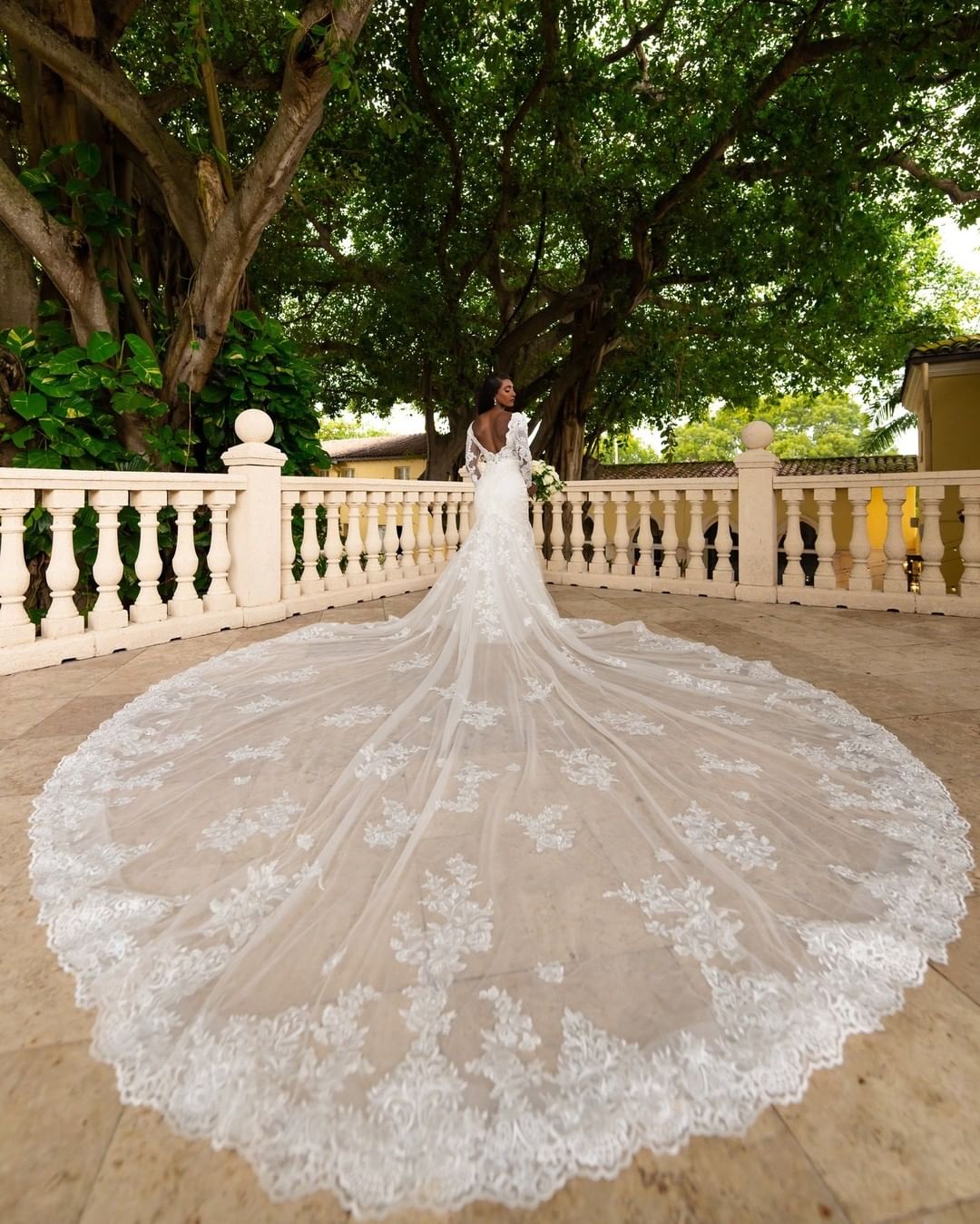 best wedding venues in florida bride in dress with long trail