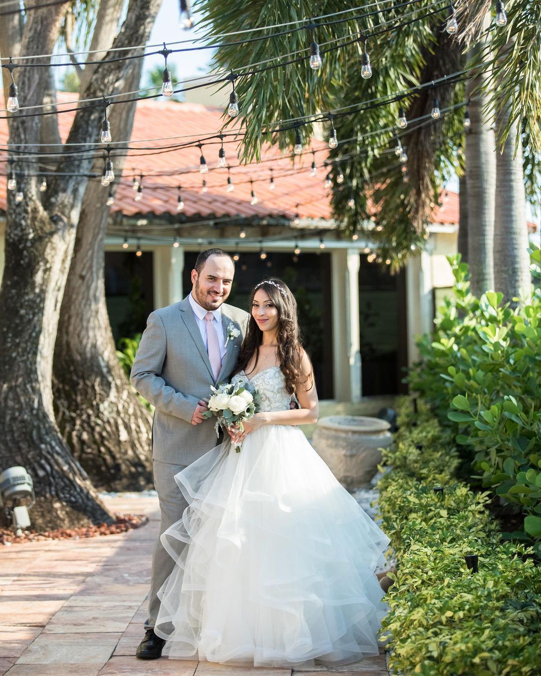 best wedding venues in florida newlyweds in the yard with lanterns