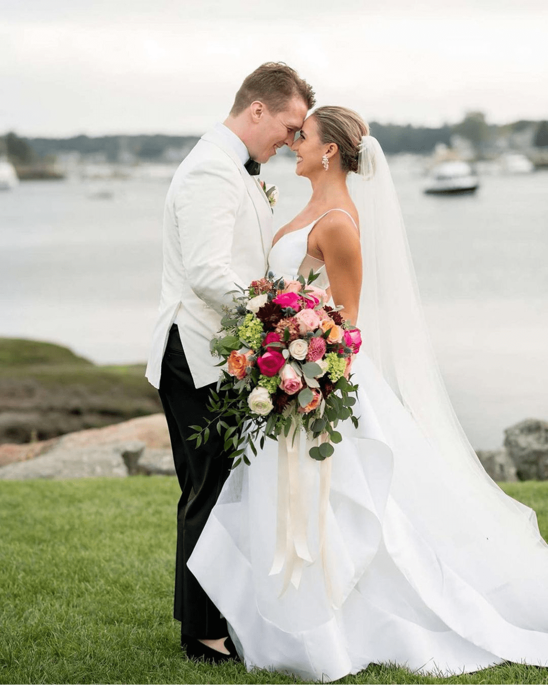 best wedding venues in new england bride and groom standing near water